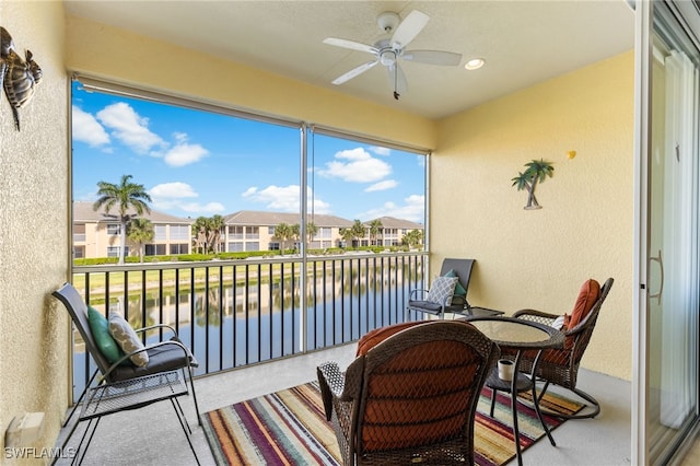 14524 Abaco Lakes Dr Unit 203, Fort Myers, FL 33908 - sunroom with a water view, a residential view, and ceiling fan