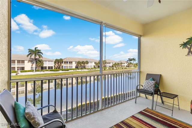 14524 Abaco Lakes Dr Unit 203, Fort Myers, FL 33908 - sunroom with a water view, a residential view, and a ceiling fan