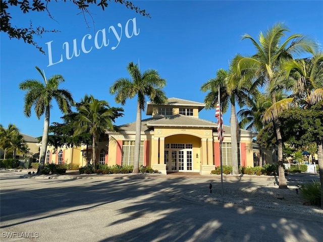 14524 Abaco Lakes Dr Unit 203, Fort Myers, FL 33908 - view of front of house featuring stucco siding and french doors