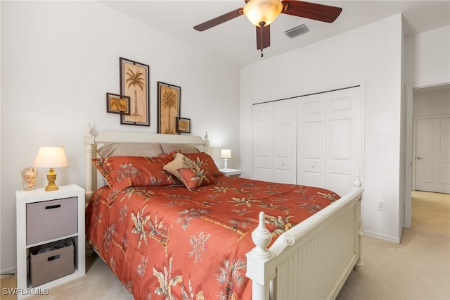 14524 Abaco Lakes Dr Unit 203, Fort Myers, FL 33908 - bedroom featuring a closet, light colored carpet, visible vents, ceiling fan, and baseboards