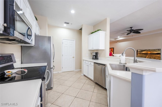 4630 Winged Foot Ct Unit 202, Naples, FL 34112 - kitchen featuring white cabinetry, a peninsula, appliances with stainless steel finishes, and a sink