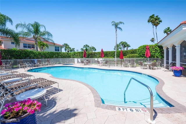 4630 Winged Foot Ct Unit 202, Naples, FL 34112 - pool with fence and a patio area