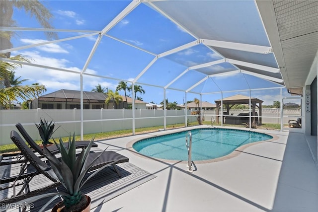 2640 SW 29th Ave, Cape Coral, FL 33914 - view of swimming pool featuring a patio, a fenced backyard, and glass enclosure