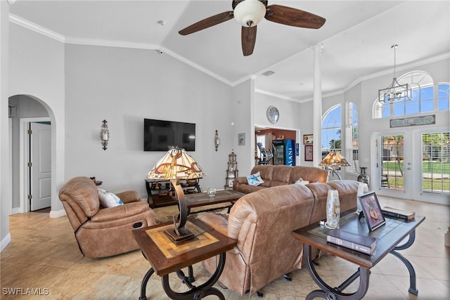2640 SW 29th Ave, Cape Coral, FL 33914 - living room with high vaulted ceiling, arched walkways, ceiling fan, baseboards, and ornamental molding