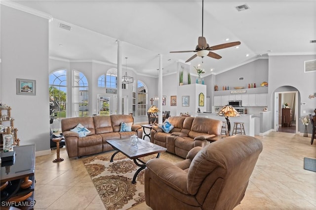 2640 SW 29th Ave, Cape Coral, FL 33914 - living area with high vaulted ceiling, arched walkways, a ceiling fan, crown molding, and light tile patterned flooring