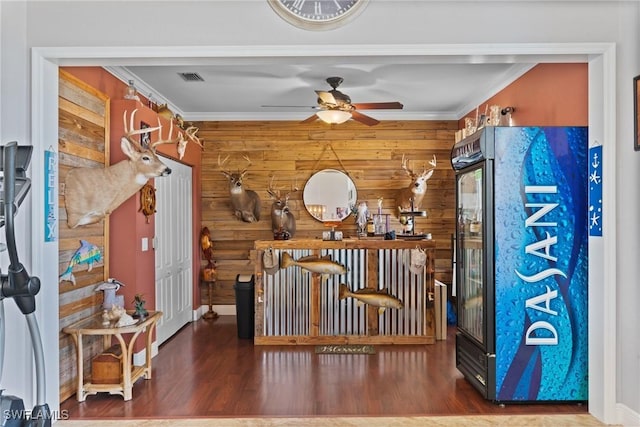 2640 SW 29th Ave, Cape Coral, FL 33914 - bar featuring wooden walls, a ceiling fan, wood finished floors, crown molding, and baseboards
