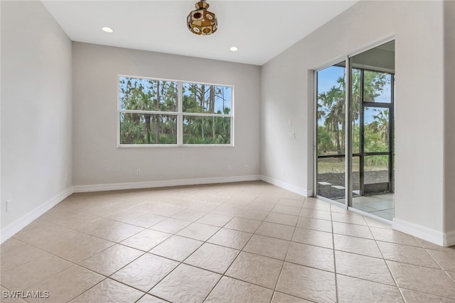 4220 12th Ave SE, Naples, FL 34117 - unfurnished room featuring light tile patterned floors, baseboards, and recessed lighting