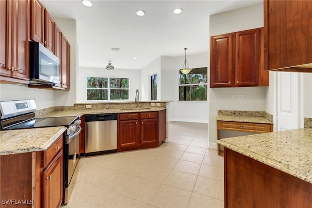 4220 12th Ave SE, Naples, FL 34117 - kitchen with a sink, a peninsula, stainless steel appliances, and a healthy amount of sunlight