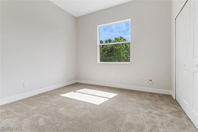 4220 12th Ave SE, Naples, FL 34117 - empty room with carpet and baseboards