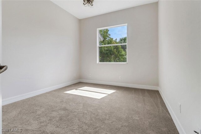4220 12th Ave SE, Naples, FL 34117 - carpeted spare room with baseboards