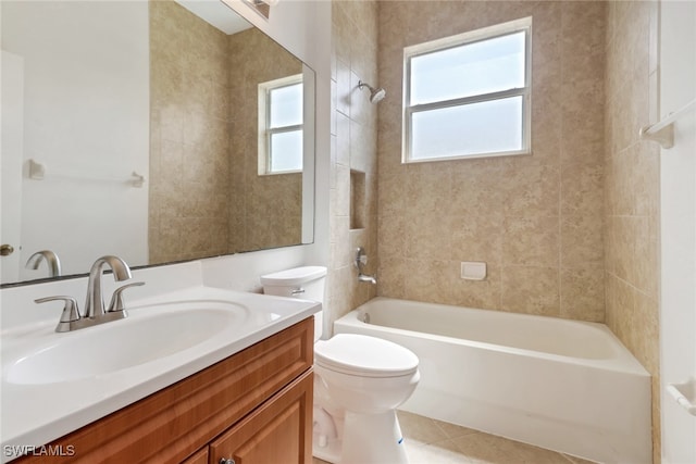 4220 12th Ave SE, Naples, FL 34117 - bathroom with toilet, tile patterned flooring, vanity, and washtub / shower combination