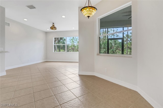 4220 12th Ave SE, Naples, FL 34117 - tiled empty room featuring baseboards, visible vents, and recessed lighting
