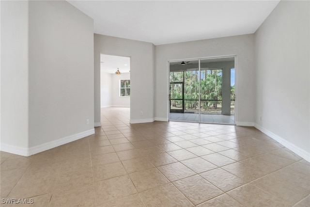 4220 12th Ave SE, Naples, FL 34117 - spare room featuring light tile patterned flooring and baseboards