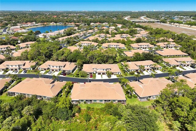 aerial view featuring a residential view and a water view