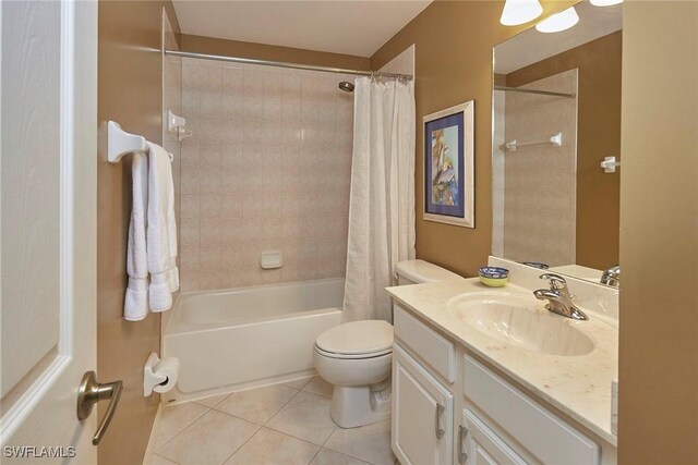 full bathroom with shower / bathtub combination with curtain, tile patterned floors, vanity, and toilet