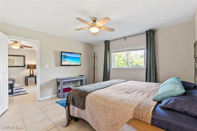 bedroom featuring light tile patterned flooring, ceiling fan, and baseboards