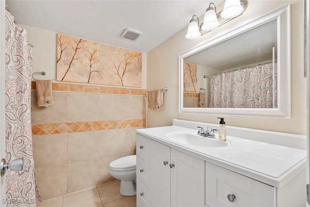 full bathroom with curtained shower, visible vents, toilet, tile patterned floors, and vanity