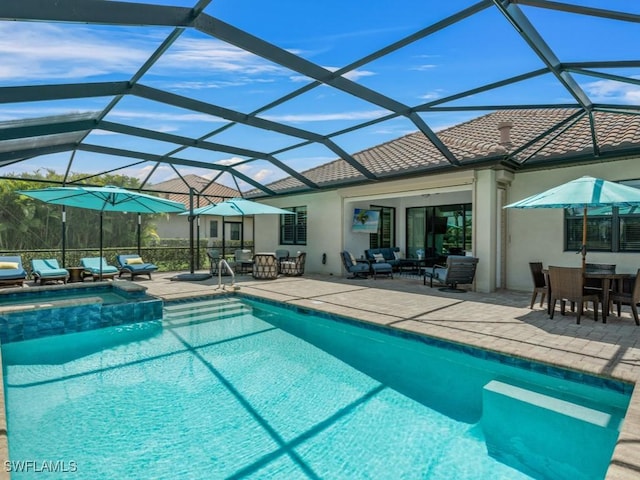 9459 Campanile Cir, Naples, FL 34114 - view of pool with a patio area, outdoor dining area, a pool with connected hot tub, an outdoor living space, and glass enclosure
