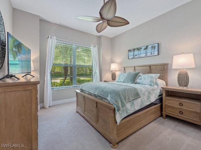 9459 Campanile Cir, Naples, FL 34114 - bedroom with light carpet, baseboards, and a ceiling fan