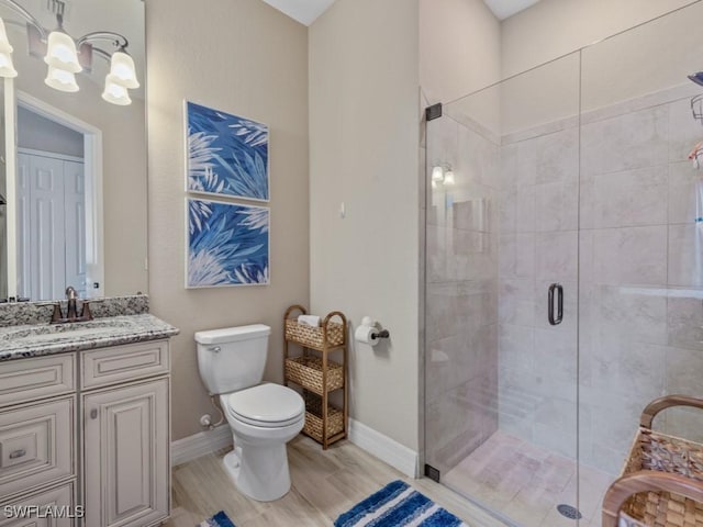9459 Campanile Cir, Naples, FL 34114 - full bathroom featuring a shower stall, a chandelier, baseboards, and toilet