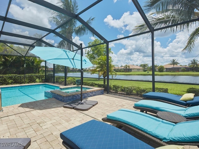 9459 Campanile Cir, Naples, FL 34114 - view of swimming pool with a water view, a lanai, a patio area, and a pool with connected hot tub