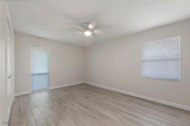 5 Rivard Rd Unit 22, Naples, FL 34112 - unfurnished room featuring ceiling fan, light wood-style flooring, and baseboards