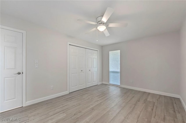 5 Rivard Rd Unit 22, Naples, FL 34112 - unfurnished bedroom with light wood-style floors, baseboards, a closet, and a ceiling fan