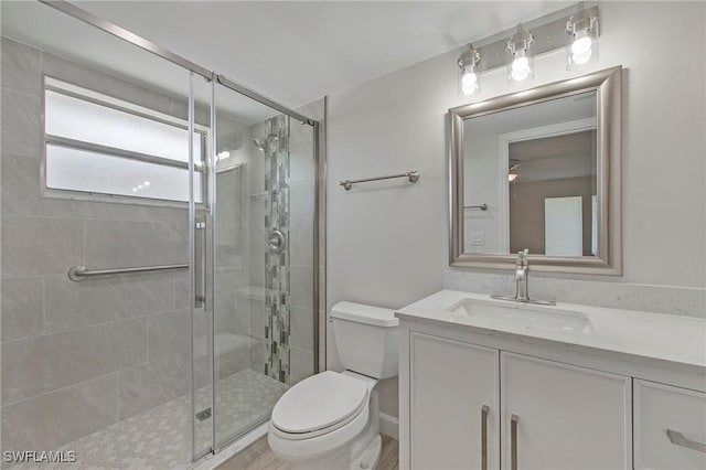 5 Rivard Rd Unit 22, Naples, FL 34112 - bathroom with toilet, a stall shower, and vanity