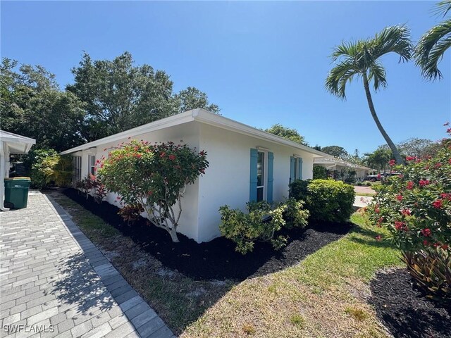 5 Rivard Rd Unit 22, Naples, FL 34112 - view of side of property featuring stucco siding