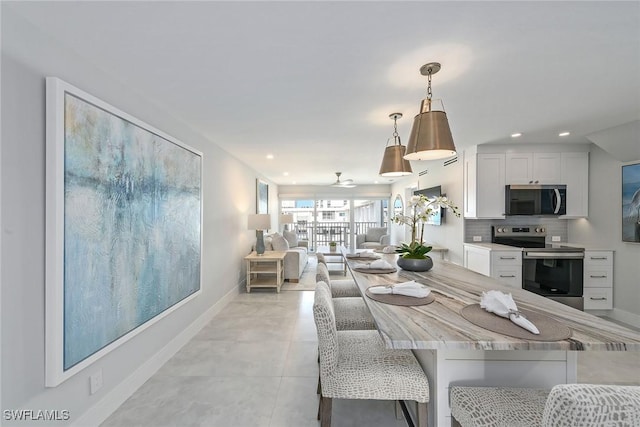 3443 Gulf Shore Blvd N Unit 813, Naples, FL 34103 - dining space with baseboards and recessed lighting