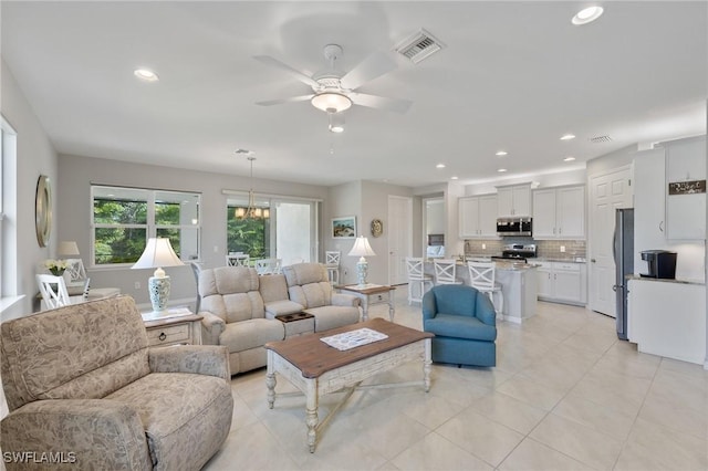 15030 Cortona Way, Fort Myers, FL 33908 - living room featuring ceiling fan, recessed lighting, visible vents, and light tile patterned floors