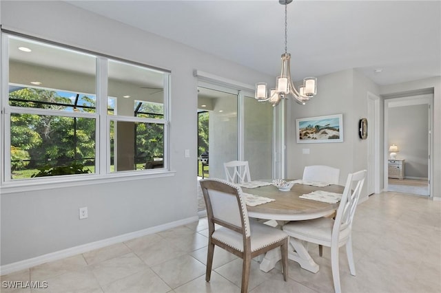 15030 Cortona Way, Fort Myers, FL 33908 - dining space with baseboards, a chandelier, and light tile patterned floors