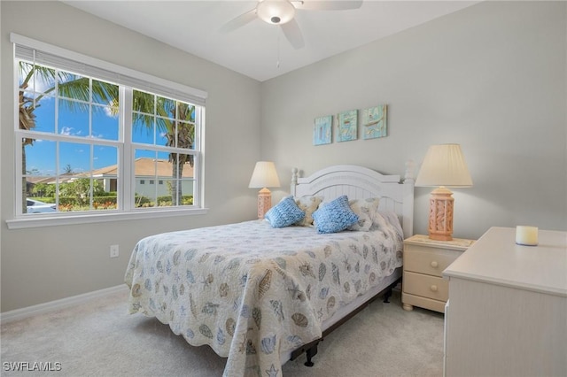 15030 Cortona Way, Fort Myers, FL 33908 - bedroom featuring ceiling fan, baseboards, and light carpet