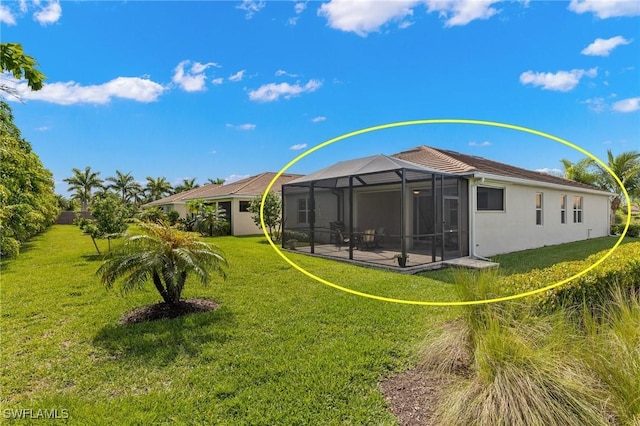 15030 Cortona Way, Fort Myers, FL 33908 - back of property featuring a lanai, a yard, and stucco siding