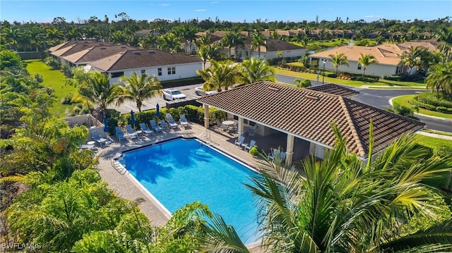 15030 Cortona Way, Fort Myers, FL 33908 - community pool featuring a patio area and a residential view