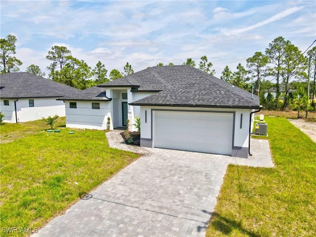 1025 Gladys St, Lehigh Acres, FL 33974 - single story home with a shingled roof, cooling unit, stucco siding, an attached garage, and a front yard