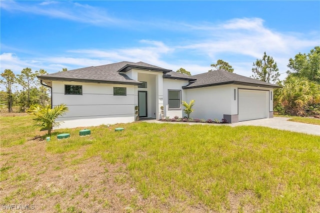 1025 Gladys St, Lehigh Acres, FL 33974 - prairie-style home with an attached garage, a front yard, and driveway