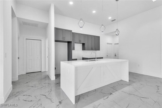 1025 Gladys St, Lehigh Acres, FL 33974 - kitchen featuring a sink, a kitchen island with sink, marble finish floor, visible vents, and recessed lighting