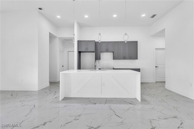 1025 Gladys St, Lehigh Acres, FL 33974 - kitchen featuring recessed lighting, baseboards, a sink, and marble finish floor