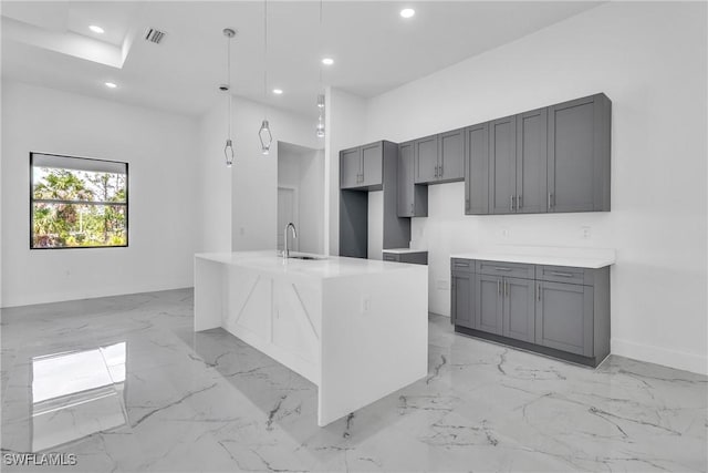 1025 Gladys St, Lehigh Acres, FL 33974 - kitchen with visible vents, gray cabinetry, a sink, and marble finish floor