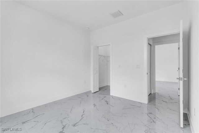 1025 Gladys St, Lehigh Acres, FL 33974 - unfurnished bedroom featuring visible vents, baseboards, and marble finish floor