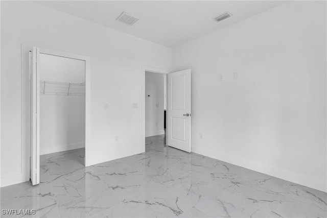 1025 Gladys St, Lehigh Acres, FL 33974 - unfurnished bedroom featuring marble finish floor, baseboards, and visible vents