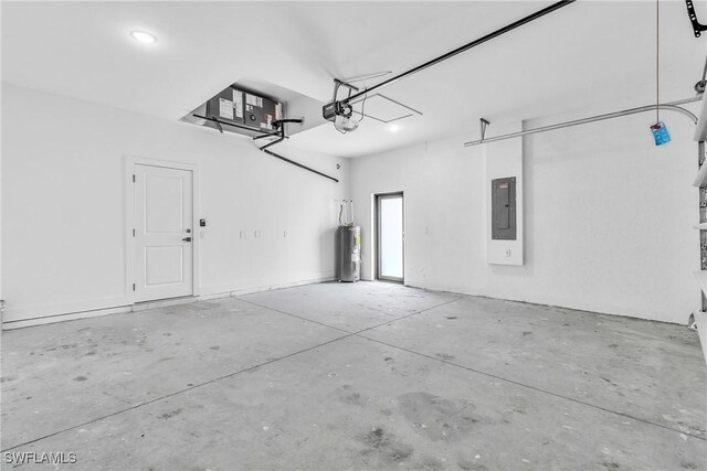 1025 Gladys St, Lehigh Acres, FL 33974 - garage featuring electric panel, electric water heater, recessed lighting, and a garage door opener