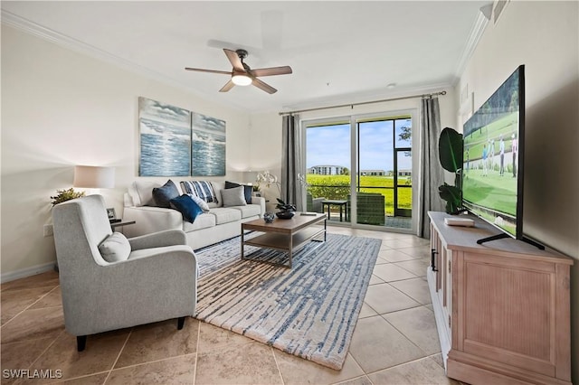 living room featuring a ceiling fan, baseboards, ornamental molding, and light tile patterned floors
