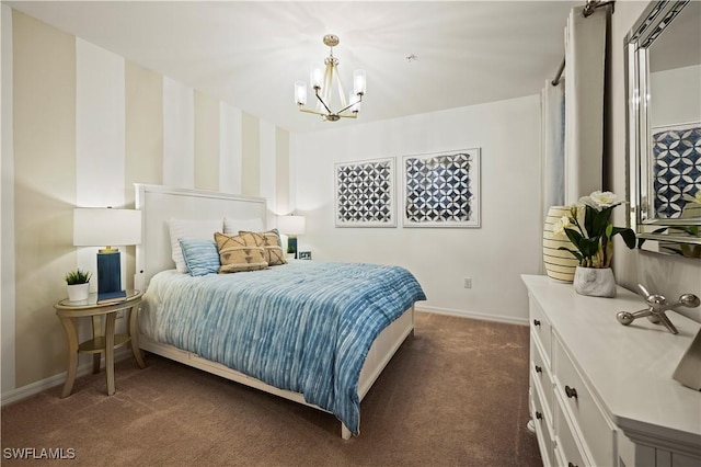 bedroom featuring dark carpet, baseboards, and a chandelier