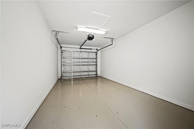 garage with baseboards and a garage door opener