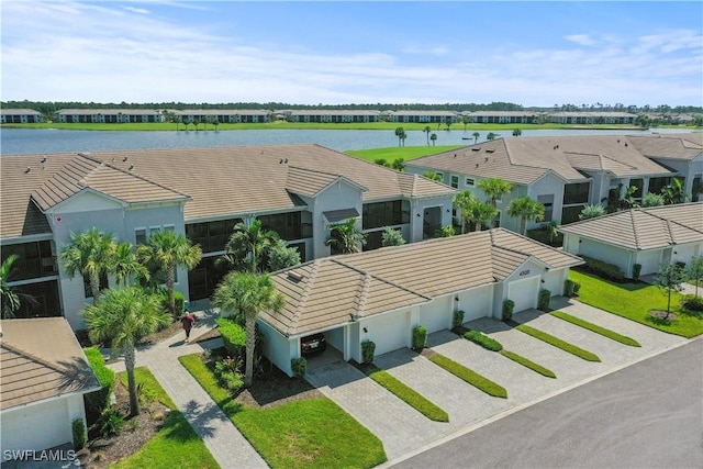 bird's eye view with a residential view and a water view