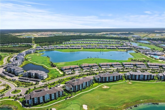 birds eye view of property with view of golf course, a residential view, and a water view