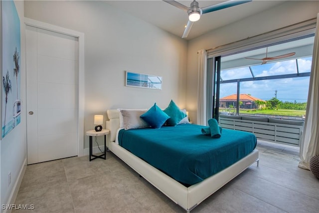 bedroom with baseboards and ceiling fan