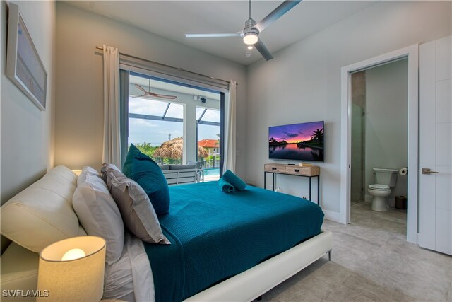 bedroom featuring ensuite bathroom, baseboards, and a ceiling fan